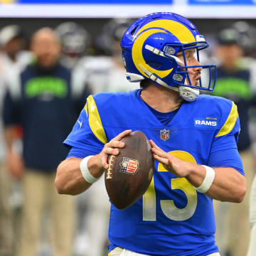 Dec 4, 2022; Inglewood, California, USA;   Los Angeles Rams quarterback John Wolford (13) sets to pass in the first half against the Seattle Seahawks at SoFi Stadium. Mandatory Credit: Jayne Kamin-Oncea-USA TODAY Sports