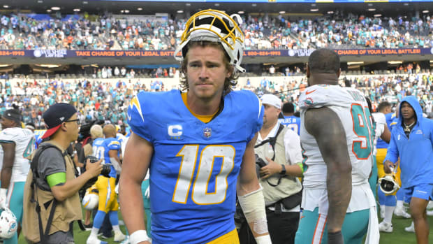 Los Angeles Chargers QB Justin Herbert leaves the field following the game against the Miami Dolphins at SoFi Stadium.