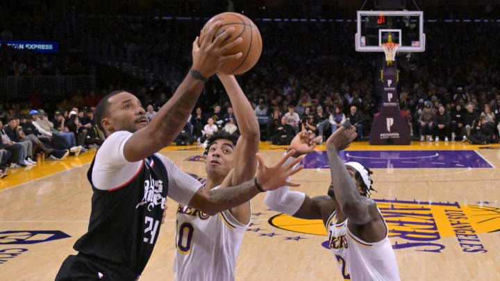 Jan 7, 2024; Los Angeles, California, USA;  Los Angeles Clippers guard Norman Powell (24) drives past Los Angeles Lakers guard Max Christie (10) in the second half at Crypto.com Arena. Mandatory Credit: