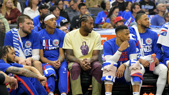 Apr 20, 2023; Los Angeles, California, USA; Los Angeles Clippers forward Kawhi Leonard (2) looks on from the bench in the first half against the Phoenix Suns at Crypto.com Arena. 