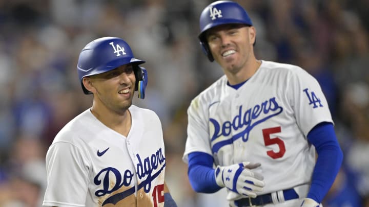 Aug 17, 2023; Los Angeles, California, USA;  Los Angeles Dodgers catcher Austin Barnes (15) is congratulated by first baseman Freddie Freeman (5) after hitting a solo home run in the eighth inning against the Milwaukee Brewers at Dodger Stadium. Mandatory Credit: Jayne Kamin-Oncea-USA TODAY Sports