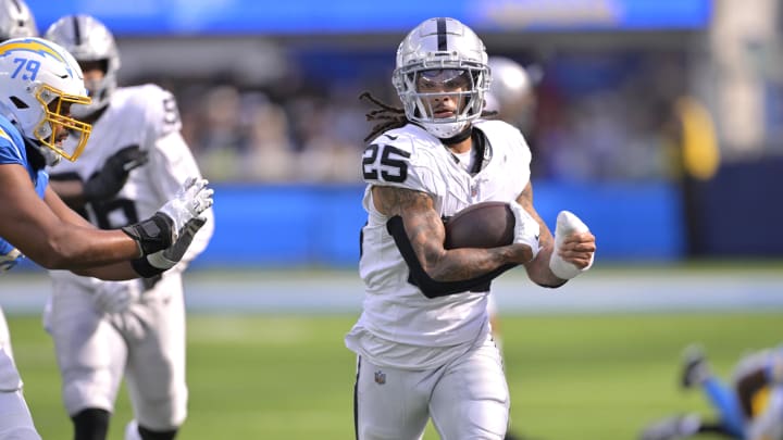 Oct 1, 2023; Inglewood, California, USA; Las Vegas Raiders safety Tre'von Moehrig (25) is forced out of bounds by Los Angeles Chargers offensive tackle Trey Pipkins III (79) after an interception in the second half at SoFi Stadium. Mandatory Credit: Jayne Kamin-Oncea-USA TODAY Sports