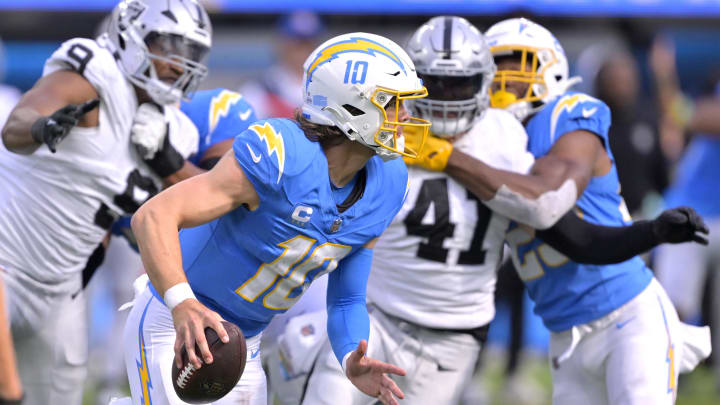 Oct 1, 2023; Inglewood, California, USA;  Los Angeles Chargers quarterback Justin Herbert (10) throws a pass in the second half against the Las Vegas Raiders at SoFi Stadium. Mandatory Credit: Jayne Kamin-Oncea-Imagn Images