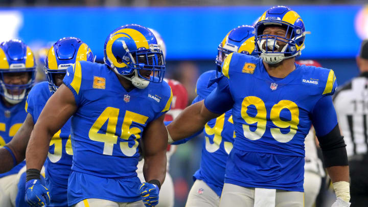 Nov 13, 2022; Inglewood, California, USA; Los Angeles Rams linebacker Bobby Wagner (45) celebrates with defensive tackle Aaron Donald (99) after a sack in the second half at SoFi Stadium. Mandatory Credit: Jayne Kamin-Oncea-USA TODAY Sports