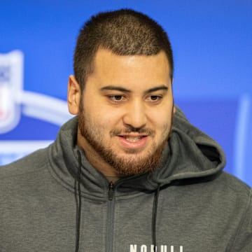 Mar 2, 2024; Indianapolis, IN, USA; Kansas offensive lineman Dominick Puni (OL59) talks to the media during the 2024 NFL Combine at Lucas Oil Stadium. Mandatory Credit: Trevor Ruszkowski-Imagn Images