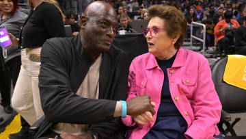 May 19, 2023; Los Angeles, California, USA;  Former Los Angeles Lakers Michael Cooper talks with former tennis player and activist Billie Jean King as they attend the game between the Los Angeles Sparks and the Phoenix Mercury at Crypto.com Arena. Mandatory Credit: Jayne Kamin-Oncea-USA TODAY Sports