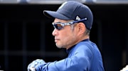 Feb 28, 2023; Peoria, Arizona, USA; Seattle Mariners coach Ichiro Suzuki (51) looks on from the dugout during the spring training game against the Cleveland Guardians at the Peoria Sports Complex. Mandatory Credit: Jayne Kamin-Oncea-Imagn Images