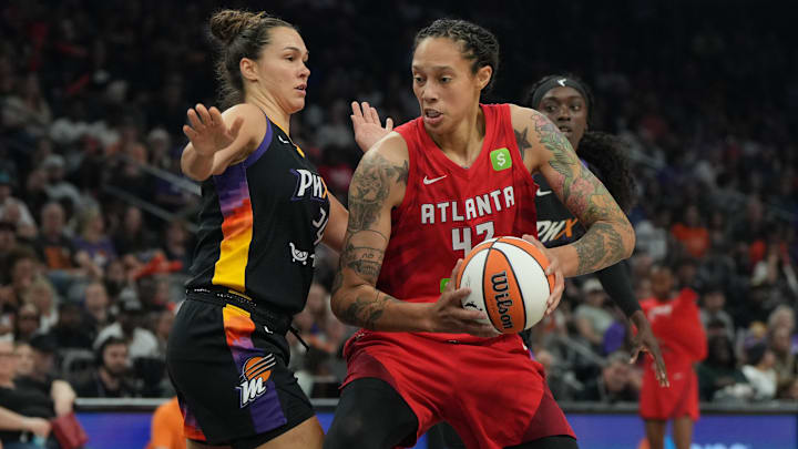 Jul 23, 2025; Phoenix, Arizona, USA; Atlanta Dream center Brittney Griner (42) drives on Phoenix Mercury forward Kathryn Westbeld (24) in the first half at Footprint Center. Mandatory Credit: Rick Scuteri-Imagn Images