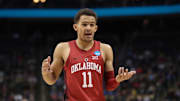 Trae Young gestures during a 2018 NCAA tournament game between Oklahoma and Rhode Island.