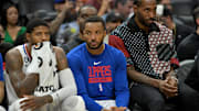 Oct 30, 2022; Los Angeles, California, USA;  Los Angeles Clippers guard Paul George (13) forward Norman Powell (24) and forward Kawhi Leonard (2) watch from the bench during the fourth quarter against the New Orleans Pelicans at Crypto.com Arena. Mandatory Credit: Jayne Kamin-Oncea-Imagn Images