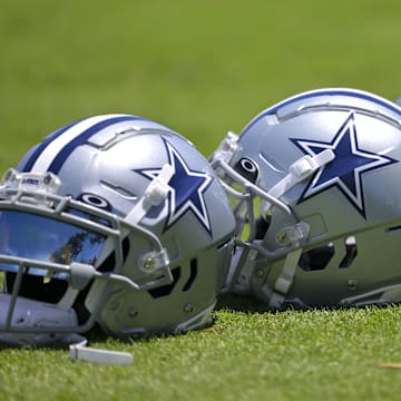 Jul 26, 2023; Oxnard, CA, USA; General view of player helmets on the field during training camp at River Ridge Playing Fields in Oxnard, CA. Mandatory Credit: Jayne Kamin-Oncea-Imagn Images