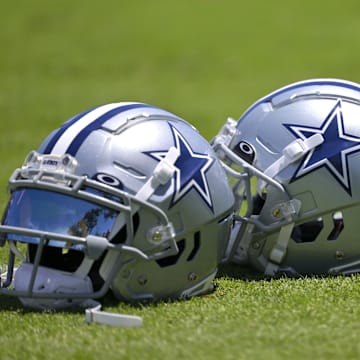 Jul 26, 2023; Oxnard, CA, USA; General view of player helmets on the field during training camp at River Ridge Playing Fields in Oxnard, CA. Mandatory Credit: Jayne Kamin-Oncea-Imagn Images