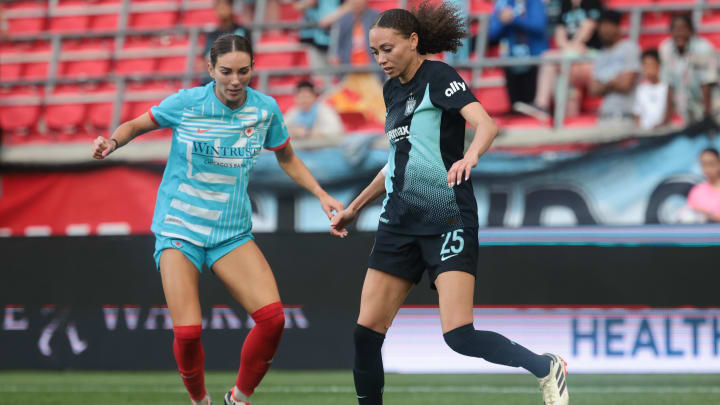 May 19, 2024; Harrison, New Jersey, USA; NJ/NY Gotham FC defender Maycee Bell (25) plays the ball against Chicago Red Stars defender Tatumn Milazzo (23) during the second half at Red Bull Arena. Mandatory Credit: Vincent Carchietta-USA TODAY Sports