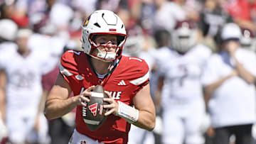 Aug 30, 2025; Louisville, Kentucky, USA; Louisville Cardinals quarterback Miller Moss (7) looks to pass against the Eastern Kentucky Colonels during the first half at L&N Federal Credit Union Stadium. Mandatory Credit: Jamie Rhodes-Imagn Images