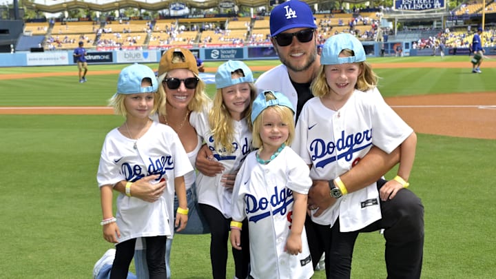 Sep 3, 2023; Los Angeles, California, USA;   Los Angeles Rams quarterback Matthew Stafford (9) with his wife Kelly with their 4 daughters on the field prior to the game between the Los Angeles Dodgers and the Atlanta Braves at Dodger Stadium. Stafford was at the game on Rams day. Mandatory Credit: Jayne Kamin-Oncea-Imagn Images