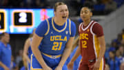 Dec 30, 2023; Los Angeles, California, USA; UCLA Bruins forward Lina Sontag (21) celebrates after a basket as USC Trojans guard JuJu Watkins (12) look on in the first half at Pauley Pavilion presented by Wescom. Mandatory Credit: Jayne Kamin-Oncea-USA TODAY Sports