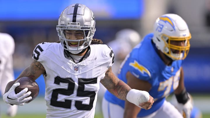 Oct 1, 2023; Inglewood, California, USA; Las Vegas Raiders safety Tre'von Moehrig (25) smiles after he was forced out of bounds by Los Angeles Chargers offensive tackle Trey Pipkins III (79) after an interception in the second half at SoFi Stadium. Mandatory Credit: Jayne Kamin-Oncea-Imagn Images