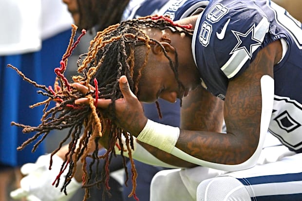 Dallas Cowboys wide receiver CeeDee Lamb sits on the bench before the start of the game against the Los Angeles Rams 