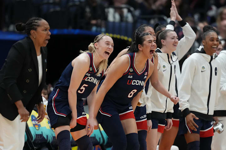 Connecticut Huskies guard Paige Bueckers and center Jana El Alfy react during the Final Four against the UCLA Bruins. 