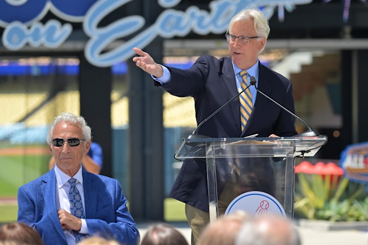 Sandy Koufax listens as Mark Walter, Owner and Chairman, Los Angeles Dodgers speaks during the unveiling of his statue. 