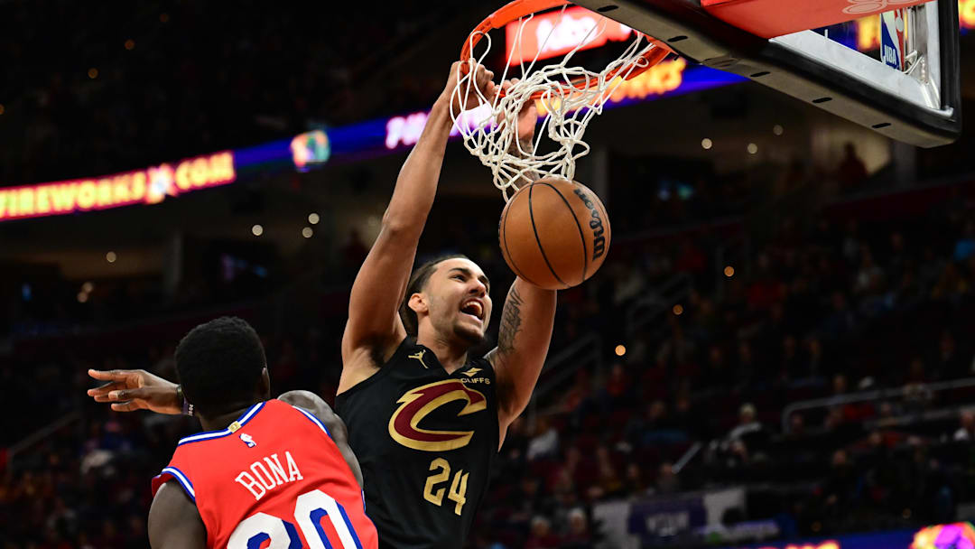 Dec 21, 2024; Cleveland, Ohio, USA; Cleveland Cavaliers forward Jaylon Tyson (24) dunks over Philadelphia 76ers center Adem Bona (30) during the second half at Rocket Mortgage FieldHouse. Mandatory Credit: Ken Blaze-Imagn Images