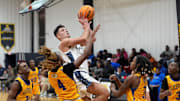 Tuscaloosa Academy's Danilo Stojakovic (1) goes for a layup against Aliceville's Zaid Caddell (4) and other defenders at Tuscaloosa Academy Tuesday, Jan. 7, 2025.