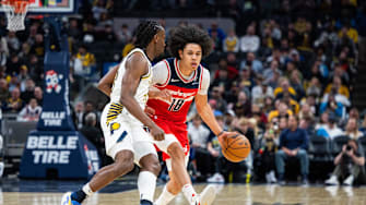 Apr 8, 2025; Indianapolis, Indiana, USA; Washington Wizards forward Kyshawn George (18) dribbles the ball while Indiana Pacers forward Aaron Nesmith (23) defends in the second half at Gainbridge Fieldhouse. Mandatory Credit: Trevor Ruszkowski-Imagn Images