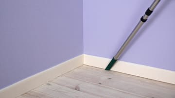 Using a vacuum is one of the easiest ways to clean baseboards.