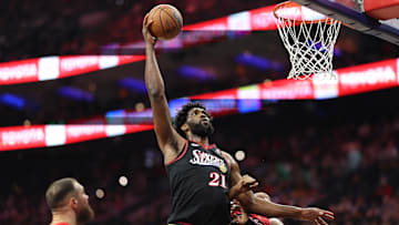 Nov 8, 2025; Philadelphia, Pennsylvania, USA; Philadelphia 76ers center Joel Embiid (21) drives for a shot against Toronto Raptors forward Scottie Barnes (4) during the second quarter at Xfinity Mobile Arena. Mandatory Credit: Bill Streicher-Imagn Images