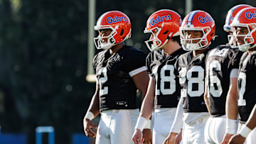 Florida Gators quarterback DJ Lagway (2), Florida Gators quarterback Clay Millen (18) and Florida Gators quarterback Aaron Williams (28) watch a drill during spring football practice at Heavener Football Complex at the University of Florida in Gainesville, FL on Thursday, March 6, 2025. [Matt Pendleton/Gainesville Sun]