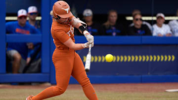 Texas infielder Joley Mitchell (9) hits a home run in the second inning of a Women's College World Series softball game between the Texas Longhorns and the Florida Gators at Devon Park in Oklahoma City, Thursday, May 29, 2025.