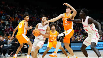 Nov 25, 2025; Las Vegas, NV, USA; Houston Cougars guard Kingston Flemings (4) drives to the basket against Tennessee Volunteers forward J.P. Estrella (13) in a 2025 Players Era Festival group play game during the first half at MGM Grand Garden Arena. Mandatory Credit: Stephen R. Sylvanie-Imagn Images