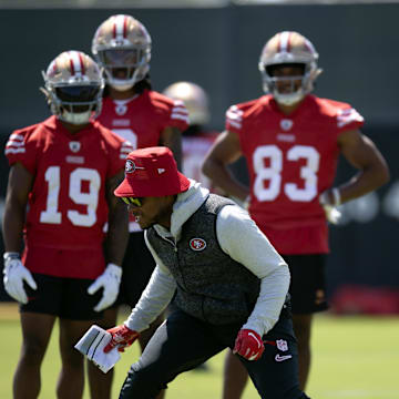 Jun 11, 2025; Santa Clara, CA, USA; San Francisco 49ers wide receiver coach Leonard Hankerson (in hat) works with his receivers during a team OTA at Levi's Stadium. Mandatory Credit: D. Ross Cameron-Imagn Images