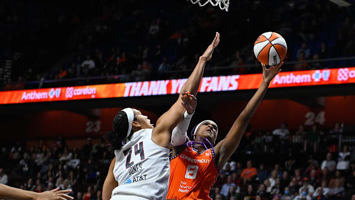 Sep 10, 2025; Uncasville, Connecticut, USA; Connecticut Sun forward Aaliyah Edwards (8) shoots a layup against Atlanta Dream forward Brionna Jones (24) during the second half at Mohegan Sun Arena. Sep 10, 2025; Uncasville, Connecticut, USA; Connecticut Sun forward Aaliyah Edwards (8) shoots a layup against Atlanta Dream forward Brionna Jones (24) during the second half at Mohegan Sun Arena.