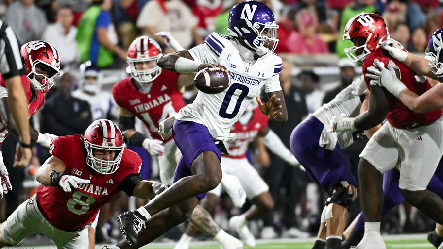 Indiana Hoosiers defensive lineman Josh Burnham pressures Northwestern Wildcats quarterback Aidan Chiles.