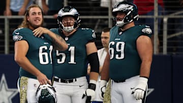  Philadelphia Eagles center Nick Gates (61) and center Cam Jurgens (51) and guard Landon Dickerson (69) stand on the field before the game against the Dallas Cowboys at AT&T Stadium.