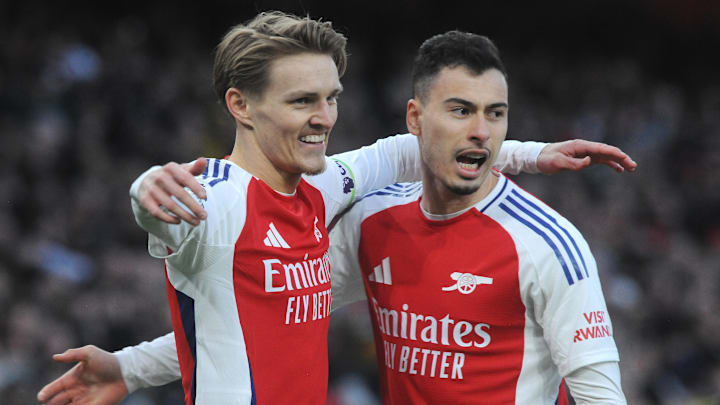 Martin Odegaard and Gabriel Martinelli celebrate Arsenal's first of five goals against the reigning champions. Martin Odegaard and Gabriel Martinelli celebrate Arsenal's first of five goals against the reigning champions.