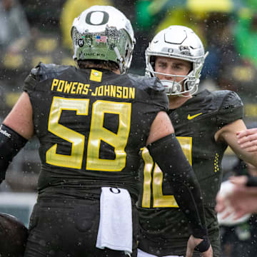 Oregon quarterback Bo Nix greets offensive lineman Jackson Powers-Johnson as the No. 6 Oregon Ducks host California Saturday, Nov. 4, 2023, at Autzen Stadium in Eugene, Ore.