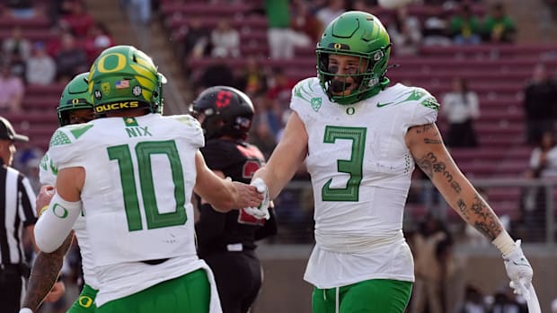 Oregon Ducks tight end Terrance Ferguson (3) is congratulated by quarterback Bo Nix (10) after scoring a touchdown against th