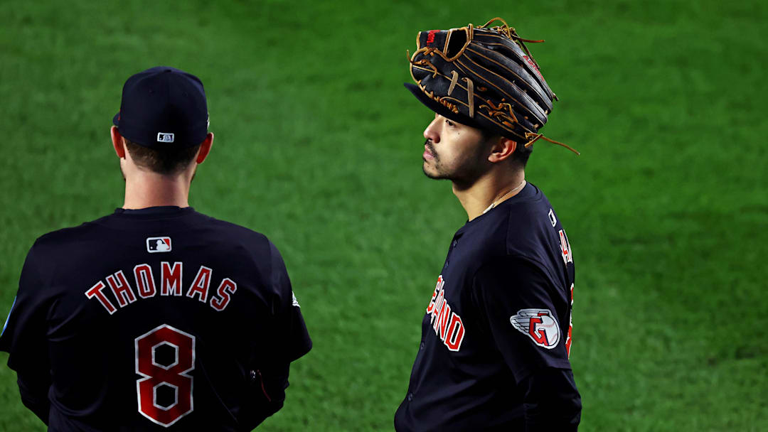 Oct 14, 2024; Bronx, New York, USA; Cleveland Guardians outfielder Steven Kwan (38) and outfielder Lane Thomas (8) wait in the outfield during the sixth inning against the New York Yankees in game one of the ALCS for the 2024 MLB Playoffs at Yankee Stadium. Mandatory Credit: Vincent Carchietta-Imagn Images