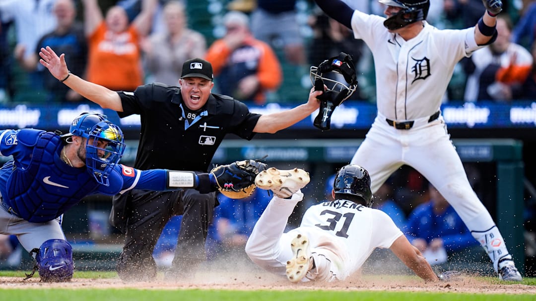 Detroit Tigers left fielder Riley Greene (31) slides into home against Kansas City Royals catcher Carter Jensen (22) to score a run. Detroit Tigers left fielder Riley Greene (31) slides into home against Kansas City Royals catcher Carter Jensen (22) to score a run.