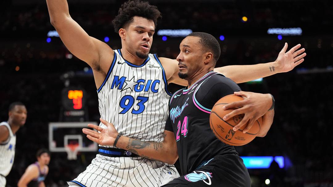 Mar 14, 2026; Miami, Florida, USA;  Miami Heat guard Norman Powell (24) drives to the basket as Orlando Magic forward Noah Penda (93) defends during the second half at Kaseya Center. Mandatory Credit: Jim Rassol-Imagn Images