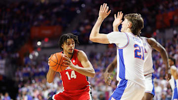 Jan 25, 2025; Gainesville, Florida, USA; Georgia Bulldogs forward Asa Newell (14) posts up against Florida Gators forward Alex Condon (21) during the first half at Exactech Arena at the Stephen C. O'Connell Center. Mandatory Credit: Matt Pendleton-Imagn Images