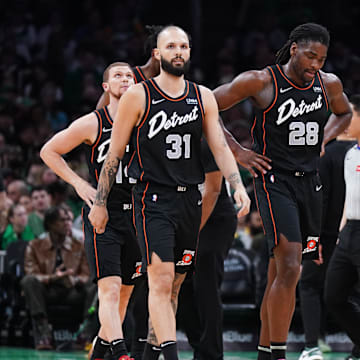 Mar 18, 2024; Boston, Massachusetts, USA; Detroit Pistons guard Evan Fournier (31), center Isaiah Stewart (28) and guard Stanley Umude (17) head to the bench during a timeout against the Boston Celtics in the first quarter at TD Garden. Mandatory Credit: David Butler II-USA TODAY Sports