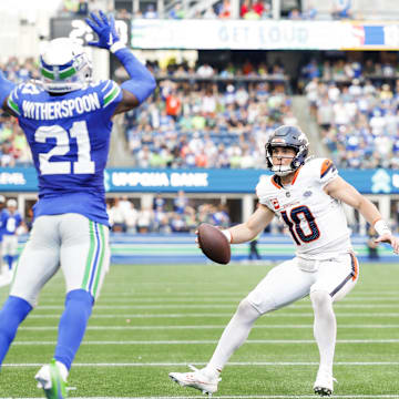 Sep 8, 2024; Seattle, Washington, USA; Denver Broncos quarterback Bo Nix (10) rushes for a touchdown against the Seattle Seahawks during the fourth quarter at Lumen Field.