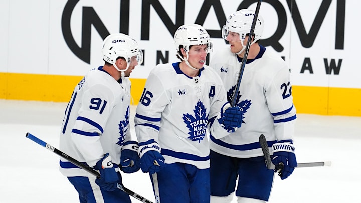 Mar 5, 2025; Las Vegas, Nevada, USA; Toronto Maple Leafs right wing Mitch Marner (16) celebrates with Toronto Maple Leafs center John Tavares (91) and Toronto Maple Leafs defenseman Jake McCabe (22) after scoring a goal against the Vegas Golden Knights during the third period at T-Mobile Arena. Mandatory Credit: Stephen R. Sylvanie-Imagn Images