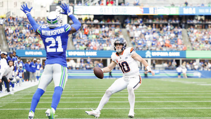 Sep 8, 2024; Seattle, Washington, USA; Denver Broncos quarterback Bo Nix (10) rushes for a touchdown against the Seattle Seahawks during the fourth quarter at Lumen Field.