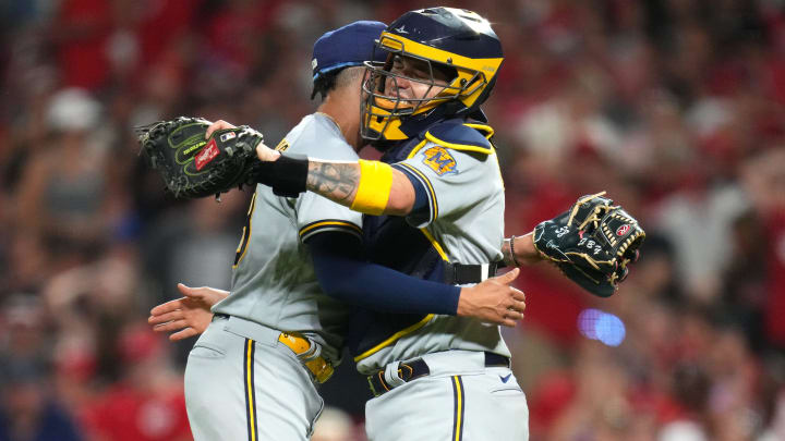 Milwaukee Brewers relief pitcher Devin Williams (38) and Milwaukee Brewers catcher Victor Caratini (7) embrace at the conclusion of a baseball game between the Milwaukee Brewers and the Cincinnati Reds, Friday, July 14, 2023, at Great American Ball Park in Cincinnati. The Milwaukee Brewers won, 1-0.