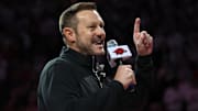 Arkansas Razorbacks new football coach Ryan Silverfield speaks to the crowd during halftime against the Louisville Cardinals at Bud Walton Arena.