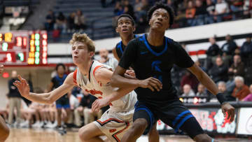 Dalton sophomore Brady Hignight and Richmond Heights sophomore Dorian Jones battle for position for a rebound during the Division IV Regional Final game at the Canton Memorial Fieldhouse, March 10, 2023.

Dalton Bulldogs Vs Richmond Heights Spartans Division Iv Regional Final High School Basketball